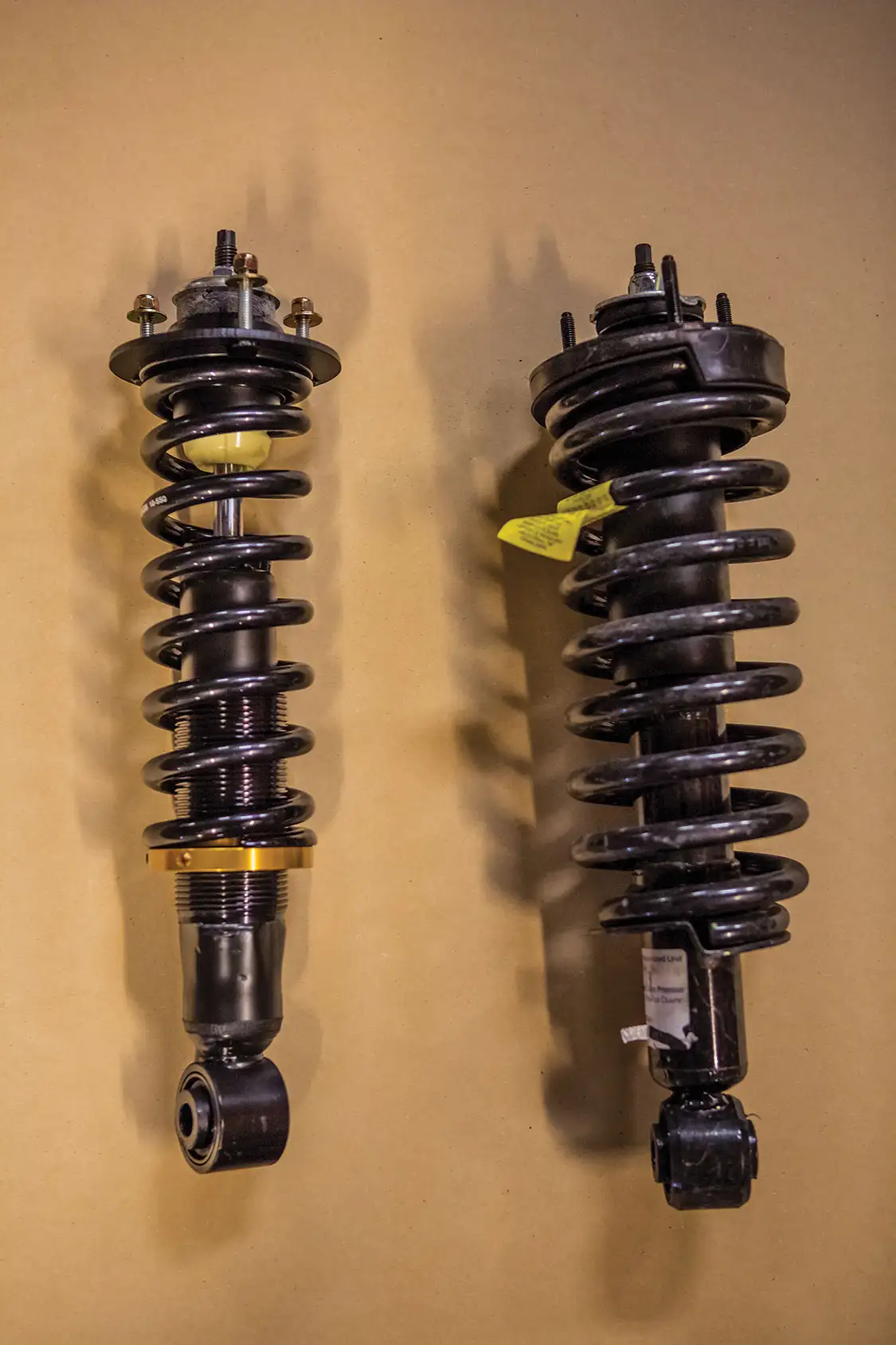 Adjustable coilover and factory shock and spring setup