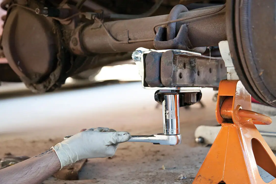 Passenger side U-bolt on the trailing arm