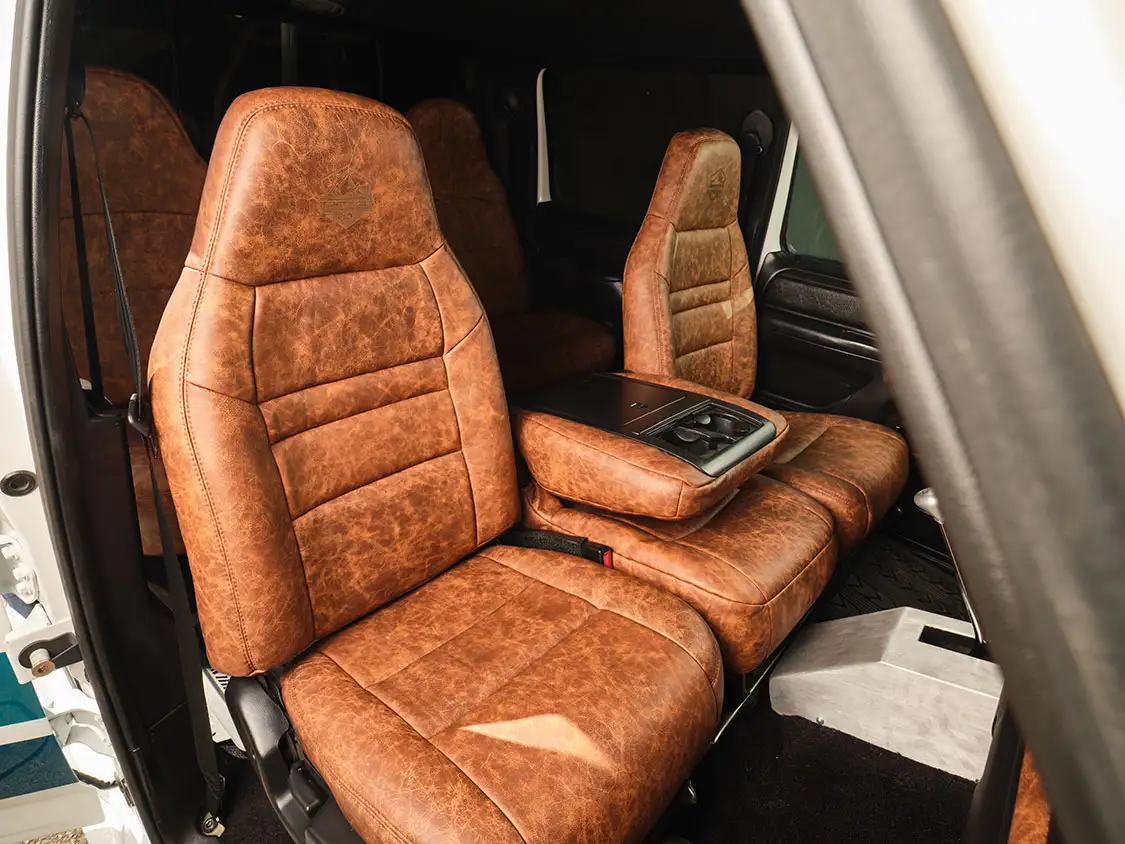 Moore and Giles leather upholstery covers the custom seats