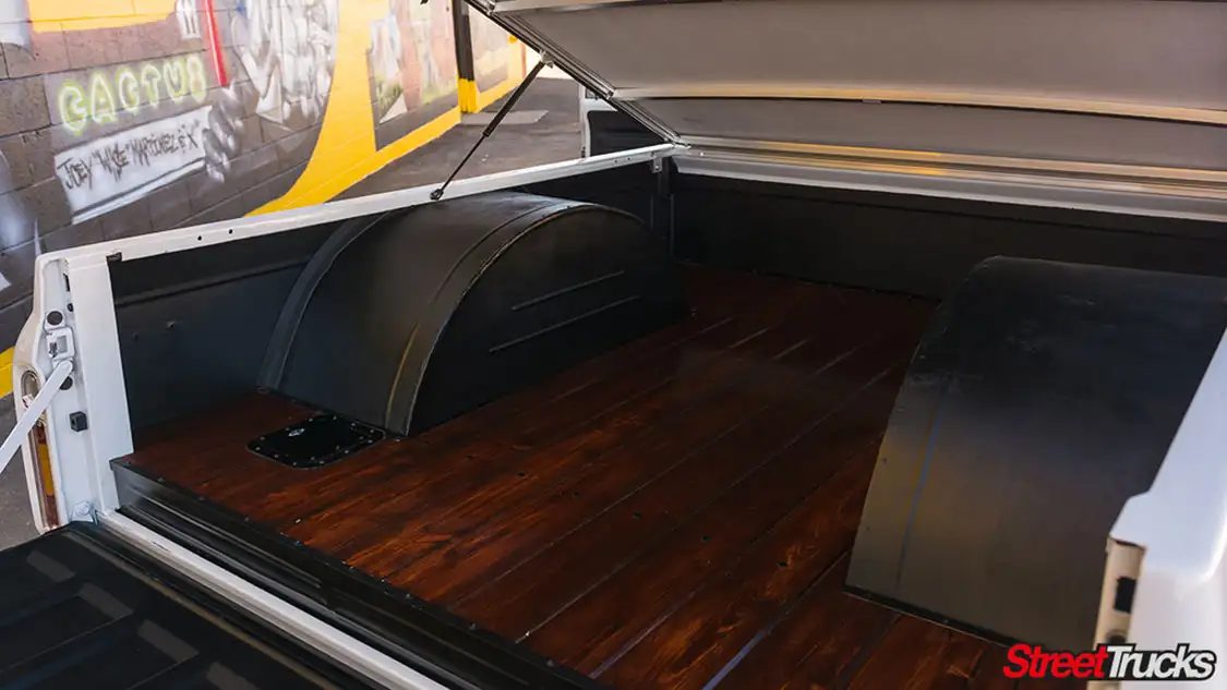 Bed floor been outfitted with a slick wood plank floor and custom tubs